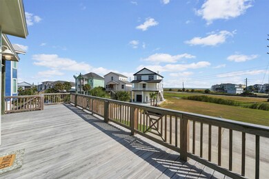 This generous front balcony invites you to unwind and take in sweeping Gulf and beach views, seamlessly extending your living space outdoors.