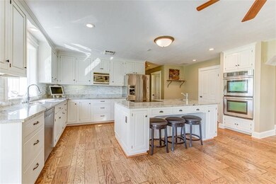 Spacious kitchen with granite counter tops and sta
