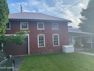 208 W Main 3 car garage and storage abov