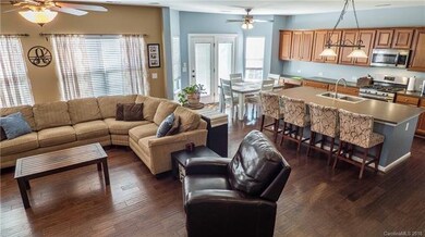 Open floor plan joining great room, kitchen, and b