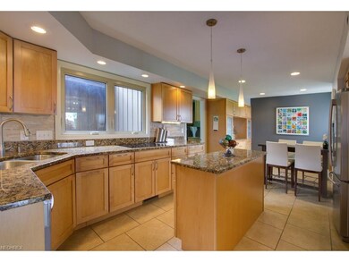 updated kitchen offers maple cabinets, stainless s