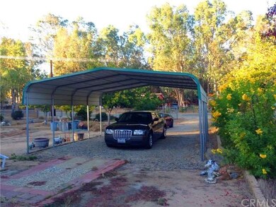 Newer Metal Carport in Front