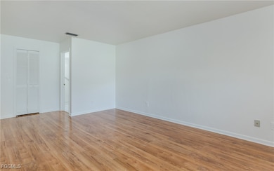 Unfurnished room featuring light wood-type flooring