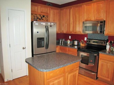 Upgraded Kitchen! Extra high Cabinets for more Storage. Built-in Wine Rack above Refrigerator.