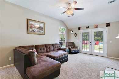 Great Room with french doors leading to back yard 