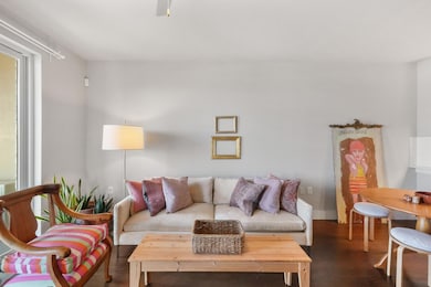 Living area featuring dark wood finished floors