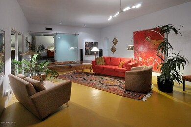 Living room w/concrete floors hi ceiling