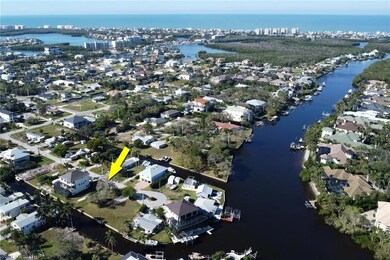 Aerial view featuring a water view and a residenti