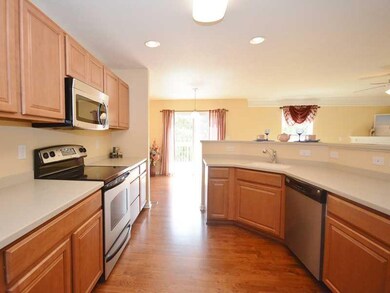 Kitchen. The kitchen features Corian countertops, 