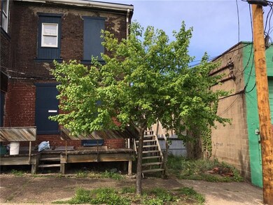 Possible parking space behind house - curb cut is 