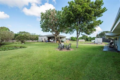 View of backyard and detached workshop and 2nd gar
