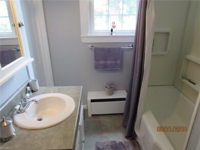 Full, updated bathroom off the kitchen.