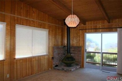 Guest bedroom/den with fireplace and ocean views!
