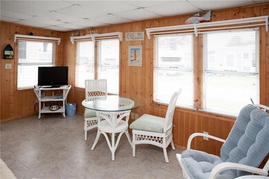 Pine paneled wall evoke a cottage feel.