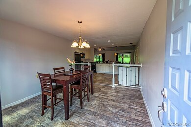 The previously enclosed front porch is an addition
