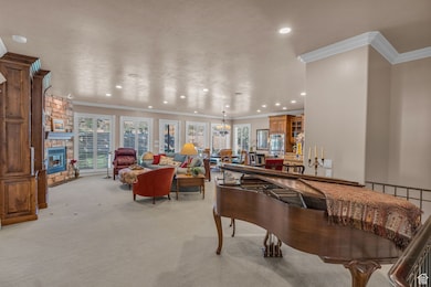 9' ceilings, custom cabinetry, stone fireplace, and radiant heating in floor