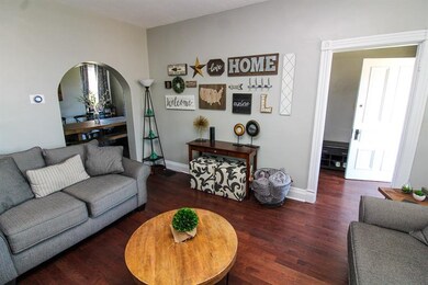 Living room looking into front entryway and dining