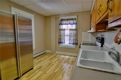 Kitchen has room for an eat-in area. Floors are ea