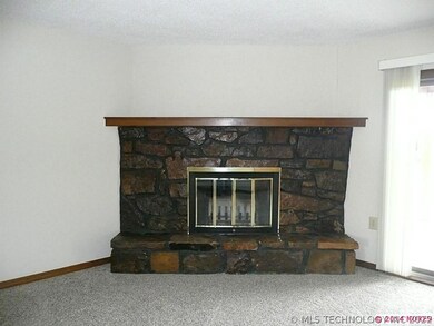 Corner fireplace with gas starter.  Wood burner.