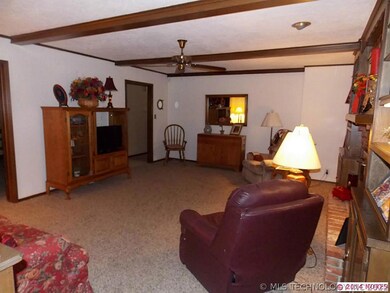 This living room also features wood beams in ceili