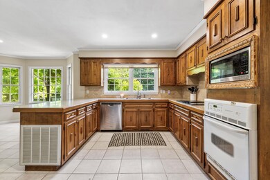 Kitchen featuring stainless steel appliances, crow
