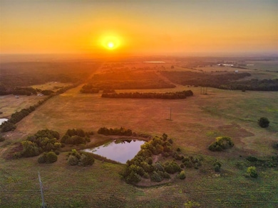 Aerial view of sparsely populated area featuring a nearby body of water