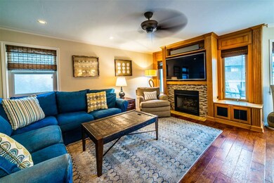 Upper Unit Living Room with Fireplace.
