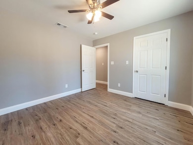 Unfurnished bedroom featuring light wood-style flooring and ceiling fan