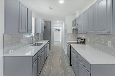 Kitchen featuring appliances with stainless steel 