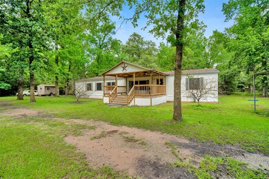 Oversized front covered porch to set out and enjoy the wildlife.