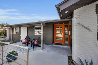 Front porch with a funky mid-century modern glass 