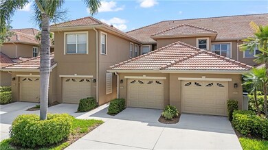 Townhome / multi-family property with a tiled roof, stucco siding, driveway, and a garage