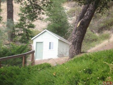 smaller of the two detached out buildings.