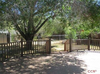 Back deck and fenced backyard split into two areas
