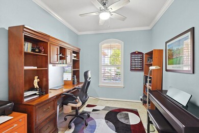 Carpeted office space with ornamental molding and 