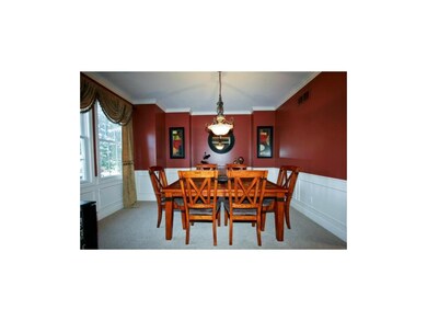 Large Dining Room with Wainscoting and Stunning Dr