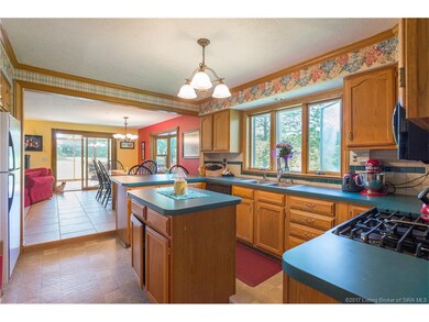 Large Kitchen has a small island and a breakfast b