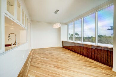 Dining room has a built-in lacquered buffet for se