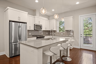 Kitchen with stainless steel appliances, a sink, 