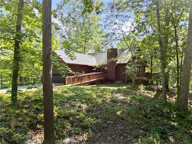 View of yard featuring a deck and a garage
