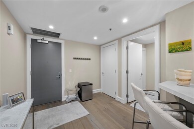 Entrance foyer with baseboards, light wood finishe