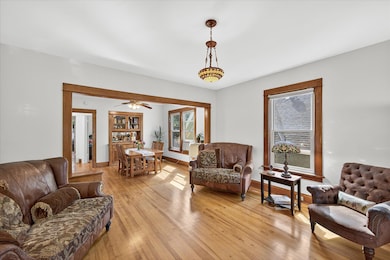 Original hardwood floors, extra wide trim, smooth ceilings with a period light fixture blend yesterday and today.