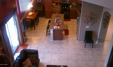 looking down from stairs to kitchen area