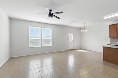 Unfurnished living room with a chandelier, ceilin
