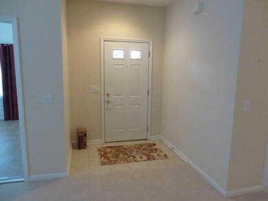 Entryway with ceramic tile flooring