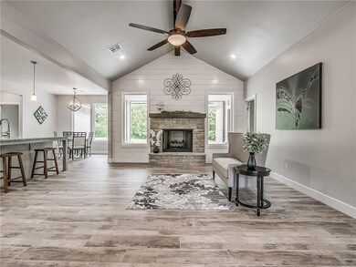 Stunning NEW HOME with large open floor plan, vaulted ceiling, large windows, wood-look tile floor, and 9 foot walls.
