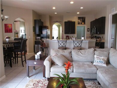 Another view looking into kitchen and in the distance formal living, dining and laundry room.