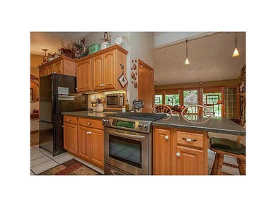 Kitchen. Solid surface counters, updated cabinetry
