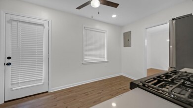Kitchen featuring hardwood / wood-style floors, ce