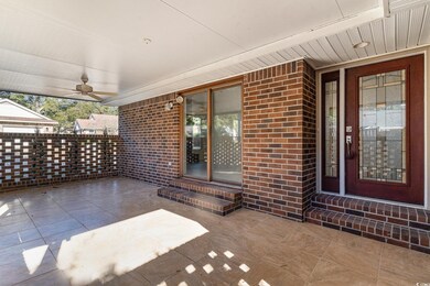 View of patio featuring ceiling fan and covered po